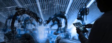 person using automation software on tablet in factory